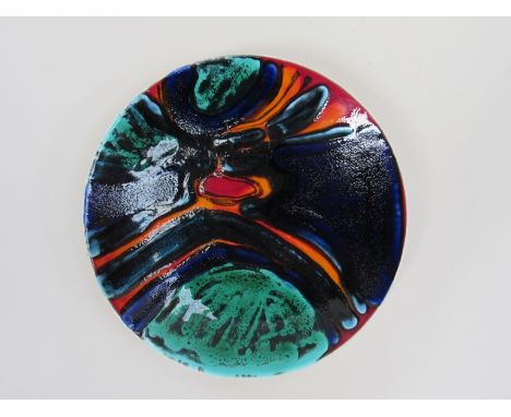 A Poole Delphis shape 4 dish by Jean Millership in red, orange, blue and green, 27cm diameter 