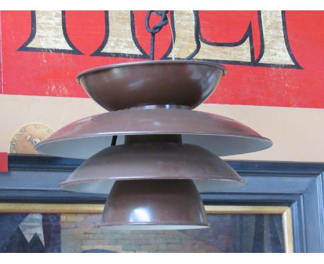 A brown four tiered ceiling light by Solar 