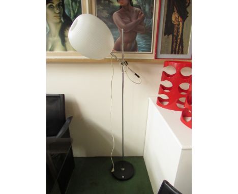 A standard lamp with adjustable chromed metal stem and ribbed plastic ovoid shade 
