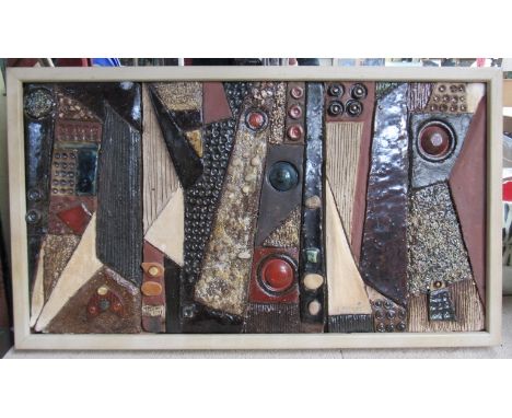 C. PIERRE (XX);A framed ceramic tiled plaque of abstract forms, signed in pencil, 28cm x 52cm