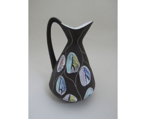 A 1950's West German ceramic jug with coloured enamel decoration, No.244/30