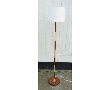 A teak and brass standard lamp 