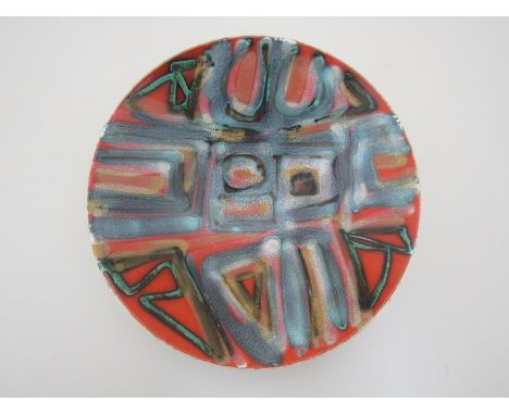 A Poole Delphis range bowl, red ground with blue grey geometric design, 27cm diameter 