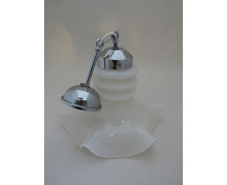 A chrome and white opaque wavy form ceiling light 