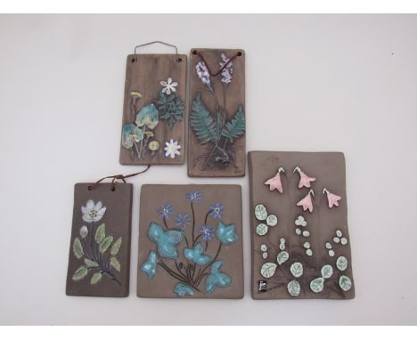 Five ceramic wall plaques with floral detail by Jie, Valles and Christina 