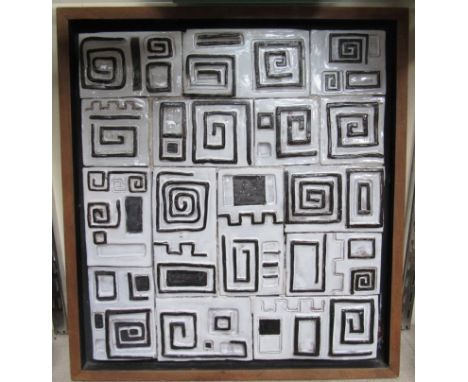 RON HITCHENS (XX):A framed ceramic tiled plaque, black and white glazed, 45cm x 41cm