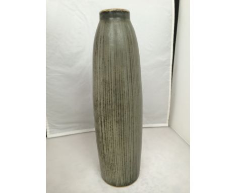 CARL HARRY STALHANE - A Rorstrand ceramic vase of slender form with grey/olive green glaze and vertical line detail. Impresse