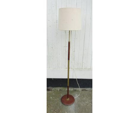 A teak and brass standard lamp 
