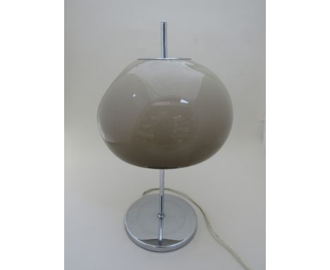A Guzzini style table lamp with mushroom coloured dome shade, chrome base. (mis-shapen shade)