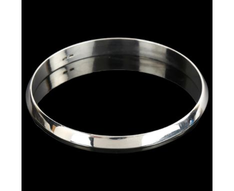 JENS JOHS AAGAARD - a heavy Danish sterling silver bangle, plain form with ridged centre, band width 7.5mm, internal circumfe