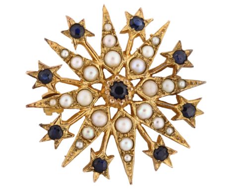 A late 20th century 9ct gold sapphire and pearl 8-ray starburst brooch, hallmarks London 1975, brooch diameter 30.3mm, 7.5gNo