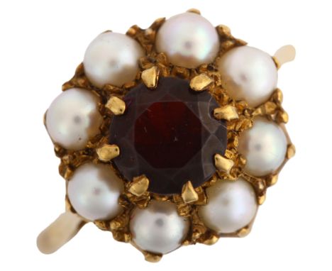 A late 20th century garnet and pearl cluster ring, unmarked gold settings with round-cut garnet, setting height 14.5mm, size 