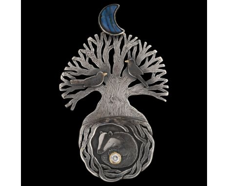 A large modern silver labradorite and diamond wildlife pendant, depicting diamond set badger beneath tree roots with nesting 