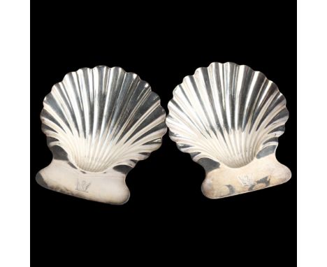 A pair of George III silver butter shells, with three shell feet and engraved crests, by Robert Garrard, hallmarks London 181