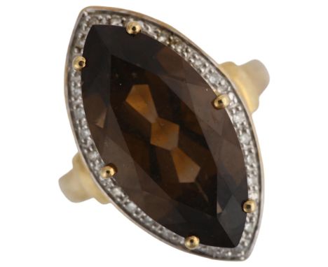 A large 9ct gold smoky quartz and diamond marquise cluster ring, setting height 23.3mm, size M, 4.6gNo damage or repairs, all