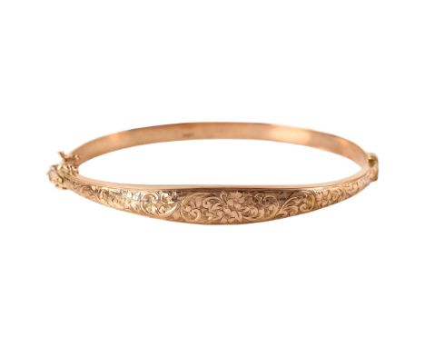 An early 20th century 9ct rose gold hinged bangle, engraved floral and foliate decoration, maker's marks S & P, hallmarks Bir