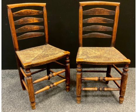 A pair of Country ladder back dining chairs, rush seats, c.1850 