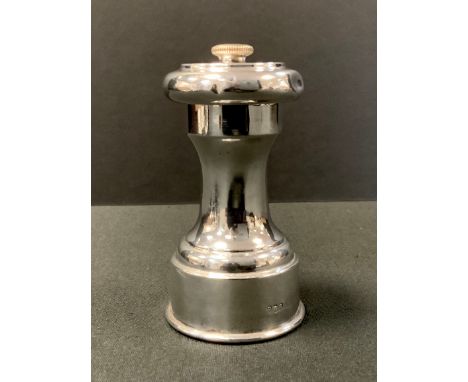A silver pepper grinder, 9cm high, Birmingham, marks rubbed 