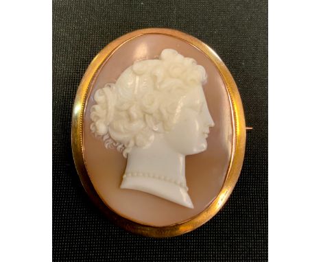 A Victorian style camel brooch, portrait of  maiden, gold coloured metal frame, stamped  A18C, 4.7cm high, 14.8g gross 