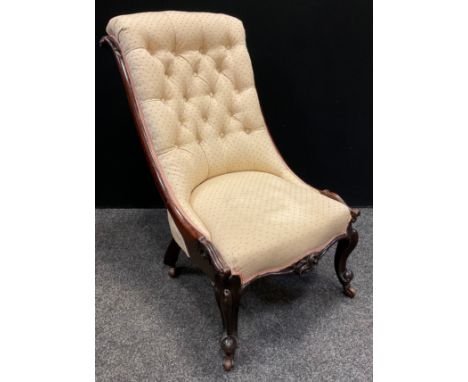 A Victorian walnut button back Slipper chair, 89cm tall, c.1880. 