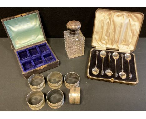 A set of six silver coffee spoons, bean terminals, Birmingham 1920, cased;  a set of six plated napkin rings;  an Edward  sil