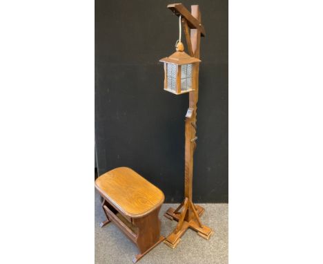 A mid 20th century oak magazine rack/side table, 57cm wide, 44cm high;  an oak hangman lantern side light (2) 