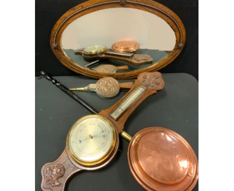 An Art Deco Style oak framed oval wall mirror, bevelled plate, 50cm x 77cm;  carved oak barometer thermometer, 83cm high;  be
