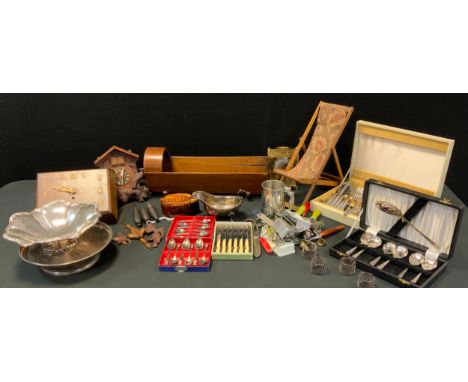An Edwardian inlaid dolls cradle;  miniature deck chair;  wall clock;  cuckoo clock;  silver plated basket;  part canteen, ca