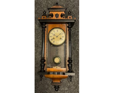 A Junghans small Vienna wall clock, walnut and ebonised wood case, painted brass face with Roman numerals, chiming movement, 
