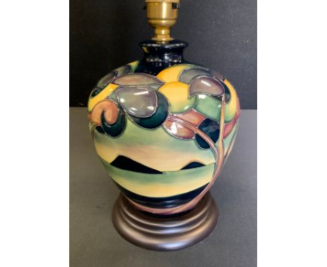 A Moorcroft Western Isles pattern compressed ovoid table lamp, designed by Sian Leaper, wooden base, shade, 43cm overall 