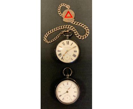 A Victorian silver open face pocket watch, white enamel dial, bold roman numerals, key wind movement, Chester 1873;  another 
