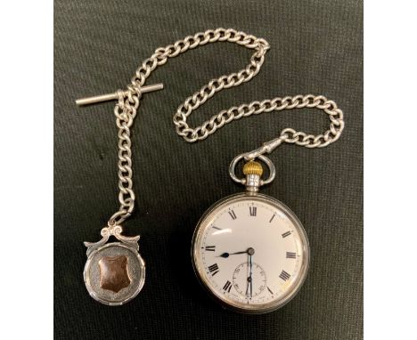 A George V silver open face pocket watch, white enamel dial, bold Roman numerals, subsidiary seconds, button wind movement, B