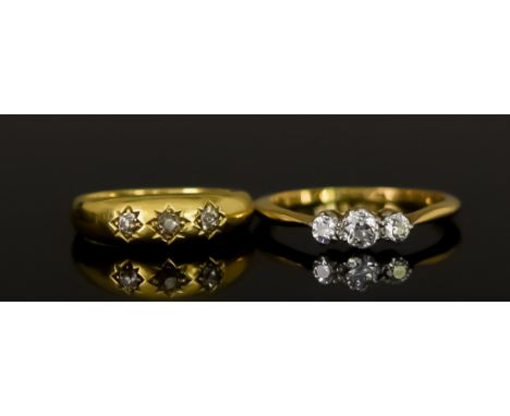 Two 18ct Gold Diamond Set Rings, 20th Century, comprising - one three stone diamond ring set with three brilliant cut white d