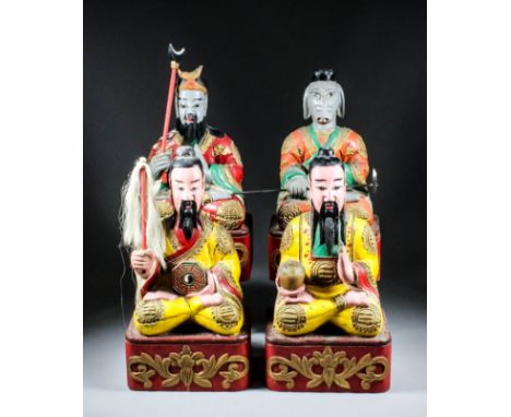 A Pair of Chinese Carved Polychrome Seated Figures of Bearded Daoist Gods, their yellow robes decorated with tri-grams, one h