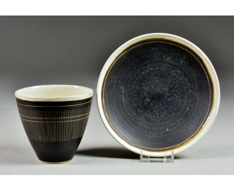 Lucie Rie (1902-1995) - Stoneware coffee cup and saucer, with oatmeal, manganese glaze, decorated with fine sgraffito lines, 