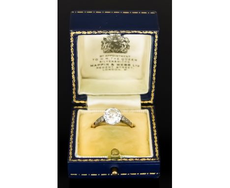 An 18ct Gold and Platinum Solitaire Diamond Ring, retailed by Mappin &amp; Webb, set with a brilliant cut white diamond, appr