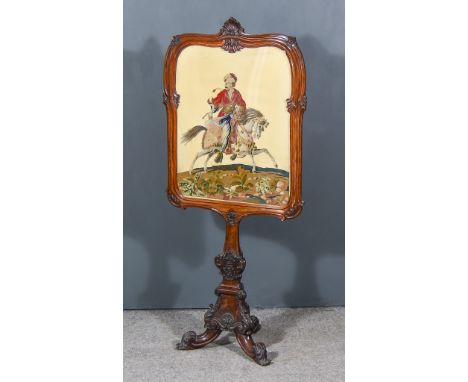 A Victorian Rosewood Rectangular Firescreen, inset with needlework panel of an Arab gentleman on horseback, on carved triangu