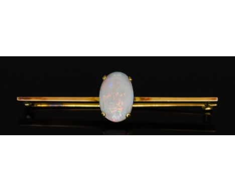 A Yellow Metal Opal Bar Brooch, 20th Century, set with oval opal stone, 16mm x 10mm, 55mm in length, gross weight 4.3g Note: 