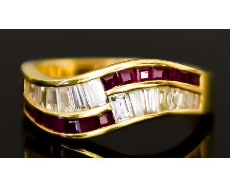 An 18ct Gold Ruby and Diamond Ring, Modern, set with baguette cut diamonds, approximately 1ct, and small red stones, approxim