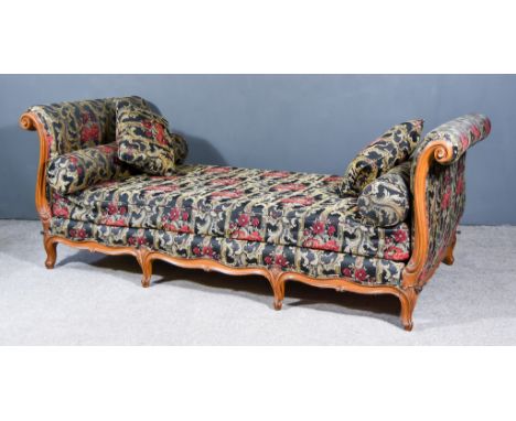 A Walnut Framed Day Bed, with moulded scroll ends, upholstered in floral tapestry, on short cabriole legs, 90ins x 40ins over