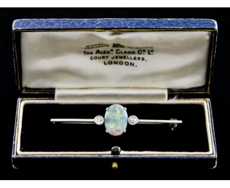 An Opal and Diamond Bar Brooch, 20th Century, retailed by Alexander Clark Co. Ltd., Court Jewellers, London, set with a centr