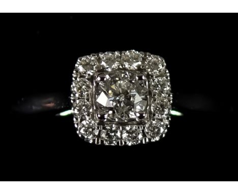 An 18ct White Gold Halo Diamond Ring, Modern, set with brilliant cut white diamonds, approximately .30ct, in presentation box
