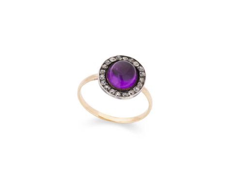 An amethyst and diamond ring Set with a cabochon amethyst in a border of eight-cut diamonds, unmarkedDimensions:Ring size: M/