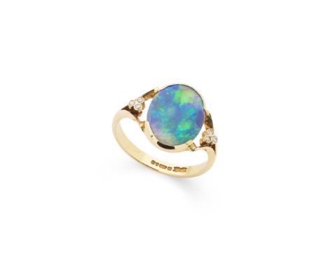 A black opal and diamond ring Part collet-set with a cabochon black opal, each shoulder set with three small eight-cut diamon