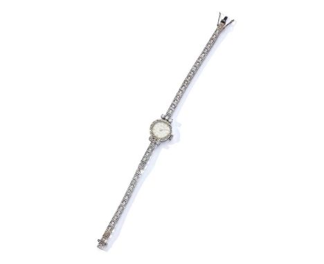Sandoz: A diamond cocktail watch Circa 1940, the circular dial with spearhead hour markers and Arabic 6 and 12, within a sing