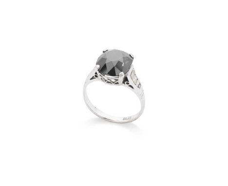 A black and colourless diamond ring Claw-set with a cushion-cut black diamond, weighing approximately 5.20cts, each shoulder 