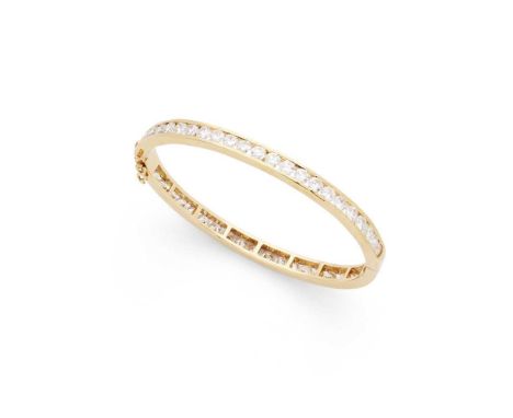 A diamond bangle Of hinged design, channel-set with a continuous row of round brilliant-cut diamonds, unmarkedDimensions:Inte