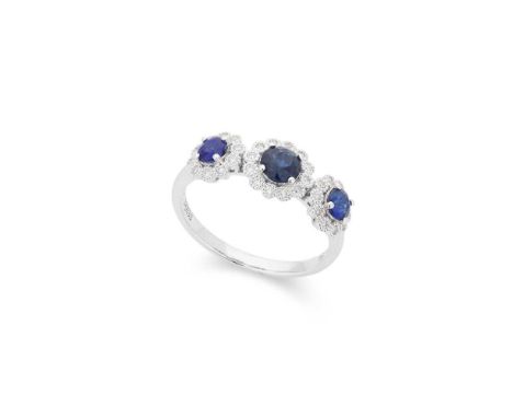 A sapphire and diamond ring Claw-set with three round-cut sapphires each in a border of small round brilliant-cut diamonds, s