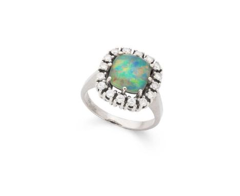 An opal triplet and diamond ring Claw-set with an opal triplet in a border of round brilliant-cut diamonds, indistinctly mark