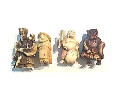 A group of 4 large size 20th century division 4 Netsuke.These are classified in the NBS in division 4. The Asian people didn'